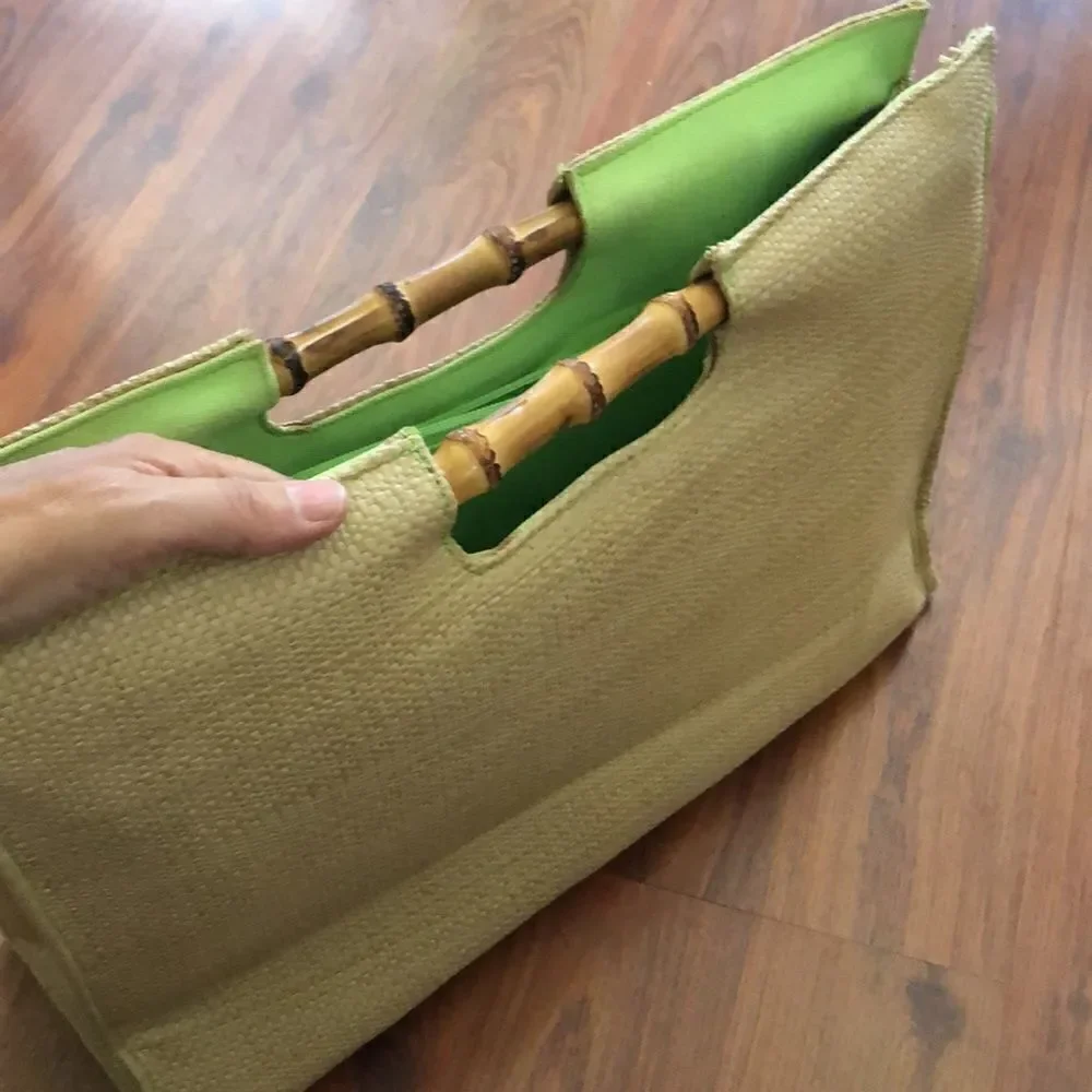 BUZZ by Jane Fox Bamboo handle woven rattan bag.